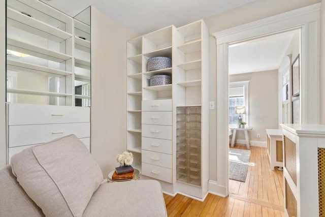 interior space with baseboards and light wood-style floors