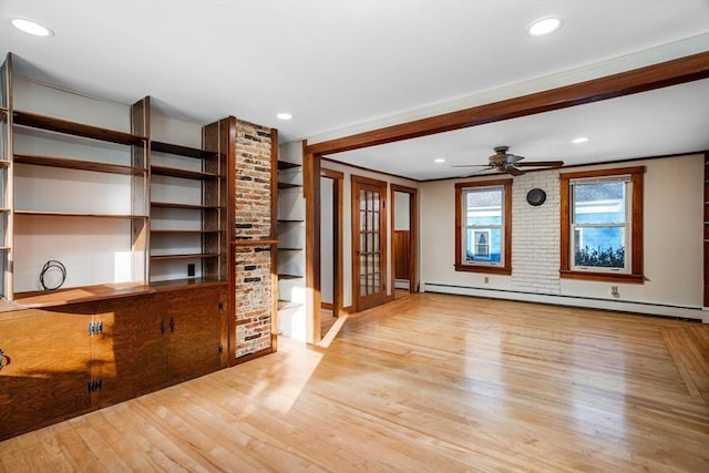 unfurnished living room featuring crown molding, ceiling fan, light hardwood / wood-style floors, and baseboard heating