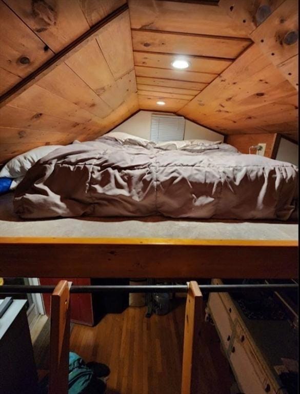 bedroom featuring wood finished floors, vaulted ceiling, and wood ceiling
