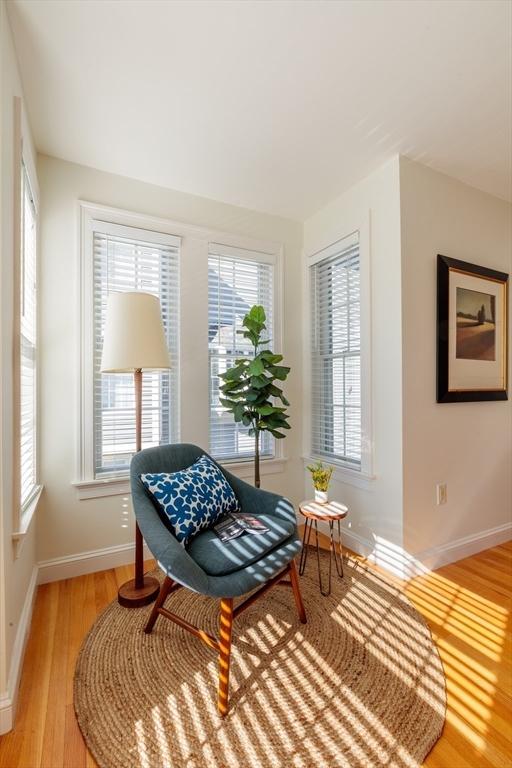 sitting room with light wood finished floors and baseboards