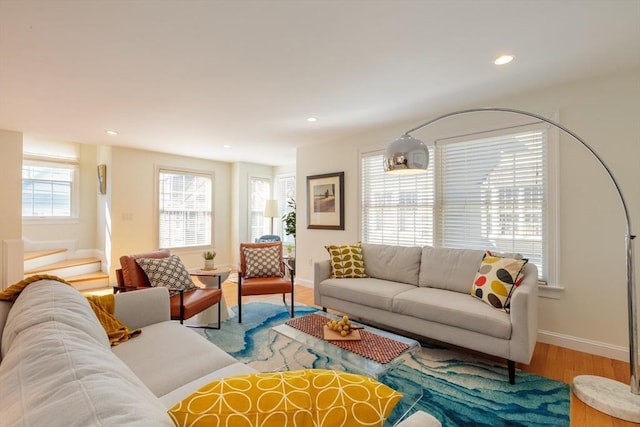 living room featuring recessed lighting, baseboards, and wood finished floors