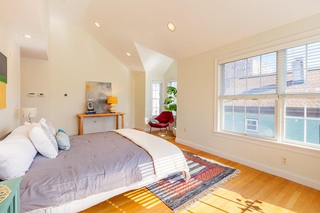 bedroom with high vaulted ceiling, baseboards, wood finished floors, and recessed lighting