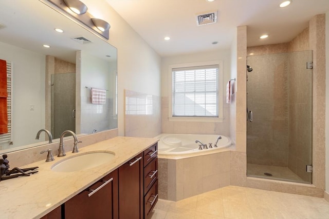 bathroom with a stall shower, a garden tub, visible vents, and tile patterned floors