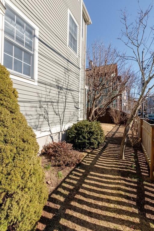 view of side of property with fence