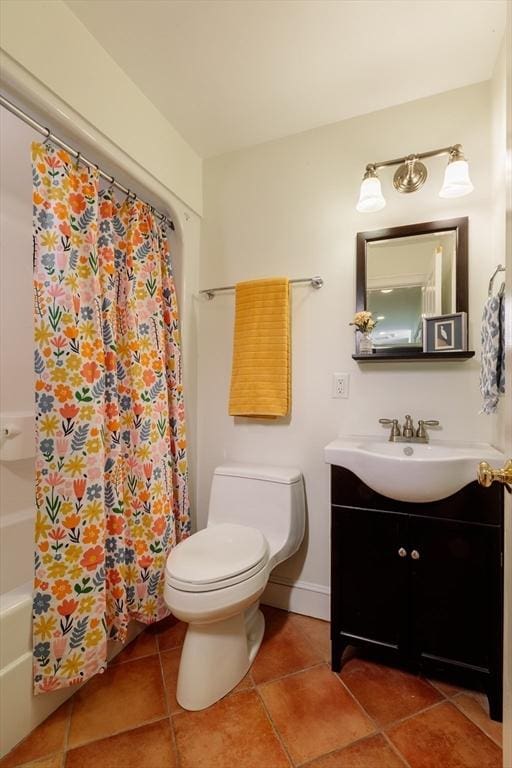 bathroom featuring shower / bath combo, baseboards, toilet, tile patterned flooring, and vanity