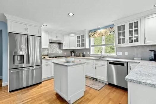 65 Tussock Brook Rd Unit 65, Duxbury, MA 02332 - kitchen with stainless steel appliances, white cabinetry, a sink, light wood finished floors, and recessed lighting