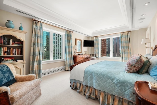 bedroom with carpet flooring, crown molding, and a tray ceiling