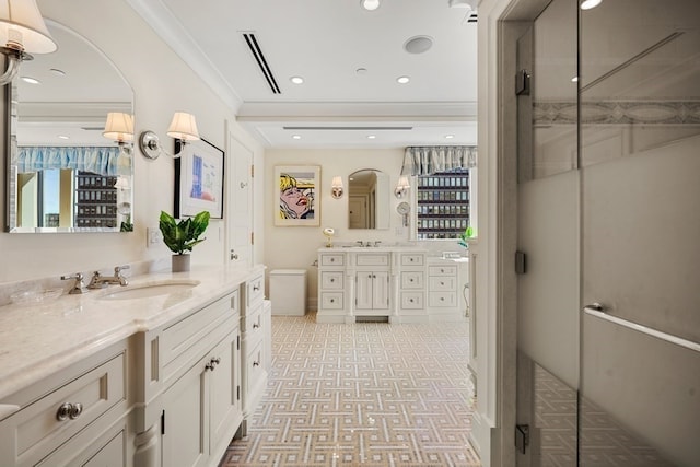 bathroom featuring ornamental molding and vanity