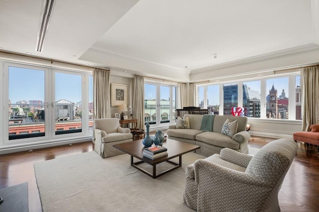 living room with a city view and crown molding