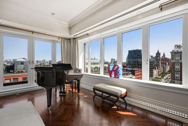 miscellaneous room featuring dark parquet flooring and ornamental molding