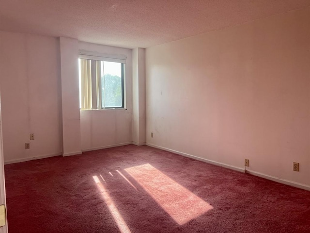 24 Corey St Unit 305, Everett, MA 02149 - spare room featuring carpet flooring, a textured ceiling, and baseboards