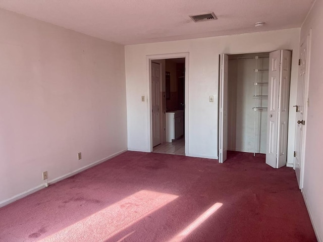 24 Corey St Unit 305, Everett, MA 02149 - unfurnished bedroom featuring carpet floors and baseboards