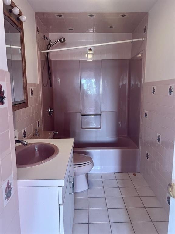 24 Corey St Unit 305, Everett, MA 02149 - full bathroom with tile walls, tile patterned floors,  shower combination, toilet, and vanity