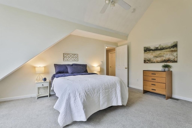 carpeted bedroom with ceiling fan, vaulted ceiling, and baseboards