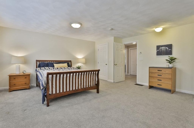 bedroom featuring carpet floors and baseboards