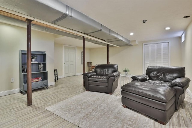 living room with baseboards, recessed lighting, and wood finished floors