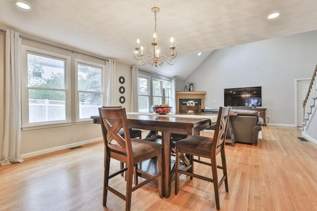 dining space featuring an inviting chandelier, light wood-style flooring, stairs, recessed lighting, and visible vents