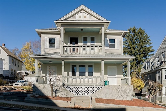 view of front of property featuring a porch and a balcony