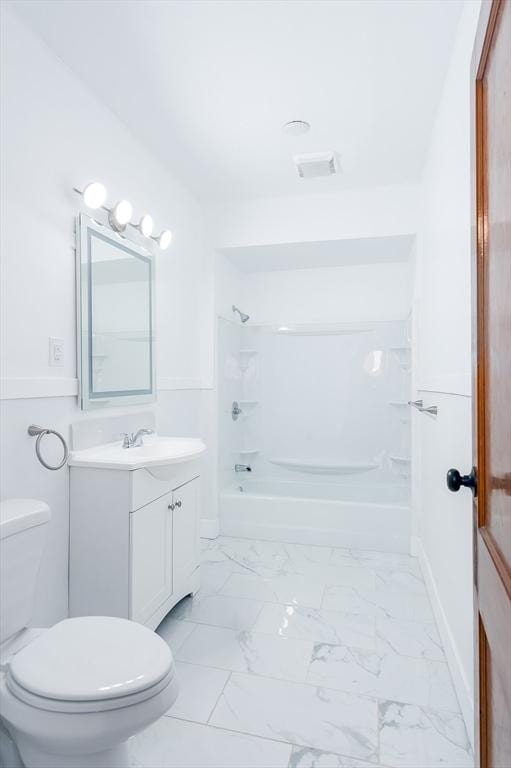 full bathroom with bathtub / shower combination, vanity, and toilet