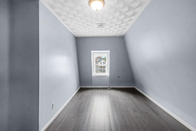 186 John St, Fall River, MA 02721 - unfurnished room featuring dark wood-style flooring and baseboards