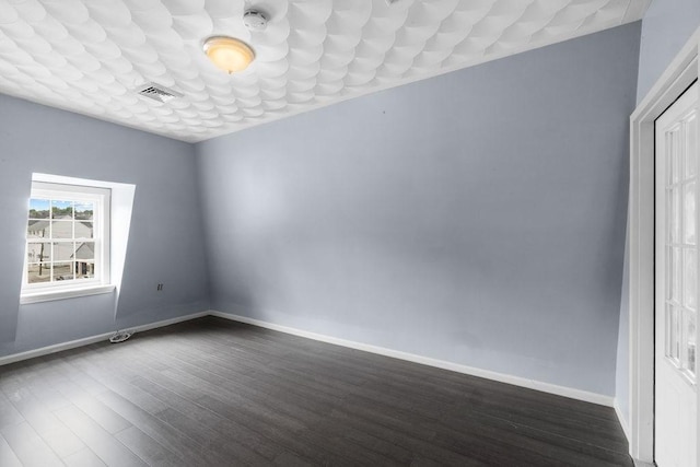 186 John St, Fall River, MA 02721 - spare room featuring dark wood finished floors and baseboards