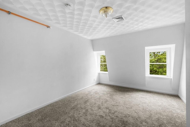 186 John St, Fall River, MA 02721 - carpeted spare room with plenty of natural light and baseboards