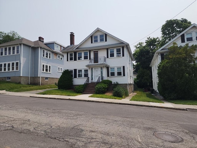 235 Common St, Watertown, MA 02472 - view of front of home featuring a chimney