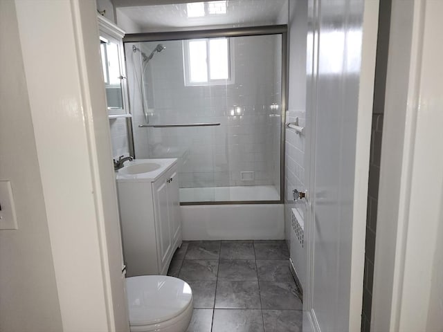 235 Common St, Watertown, MA 02472 - bathroom with toilet, vanity, and shower / washtub combination
