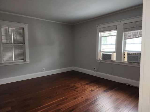 235 Common St, Watertown, MA 02472 - unfurnished room with cooling unit, dark wood-type flooring, crown molding, and baseboards