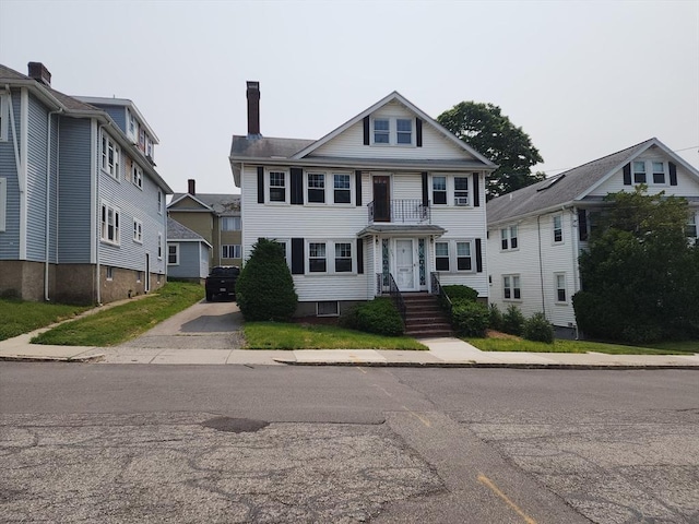 235 Common St, Watertown, MA 02472 - view of front of house with a chimney