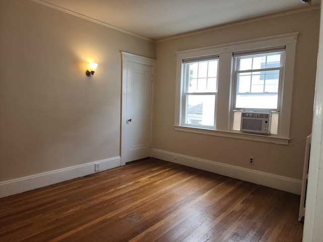 235 Common St, Watertown, MA 02472 - spare room with baseboards, wood finished floors, crown molding, and cooling unit