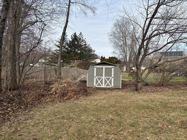 view of outdoor structure featuring a lawn