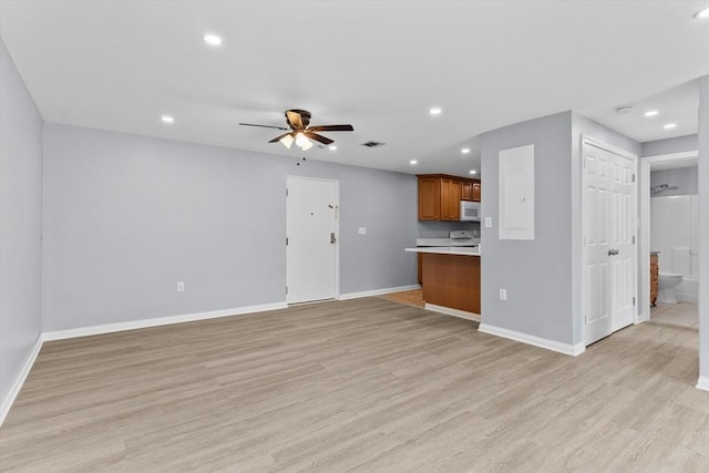404 Broadway Unit 107, Lynn, MA 01904 - unfurnished living room with a ceiling fan, light wood finished floors, and recessed lighting