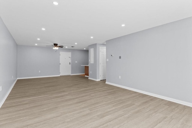 404 Broadway Unit 107, Lynn, MA 01904 - unfurnished living room featuring recessed lighting, ceiling fan, and light wood-style flooring