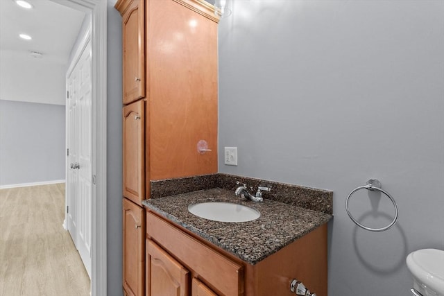 404 Broadway Unit 107, Lynn, MA 01904 - bathroom with vanity, wood finished floors, and recessed lighting