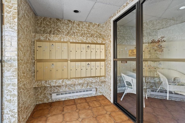 404 Broadway Unit 107, Lynn, MA 01904 - view of home's community with mail area and a paneled ceiling