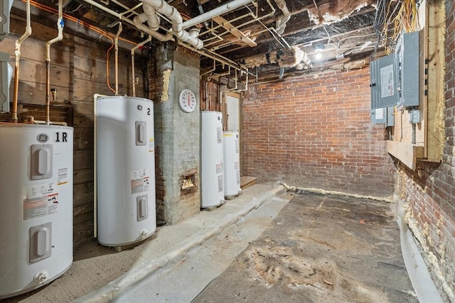 basement featuring brick wall and electric water heater