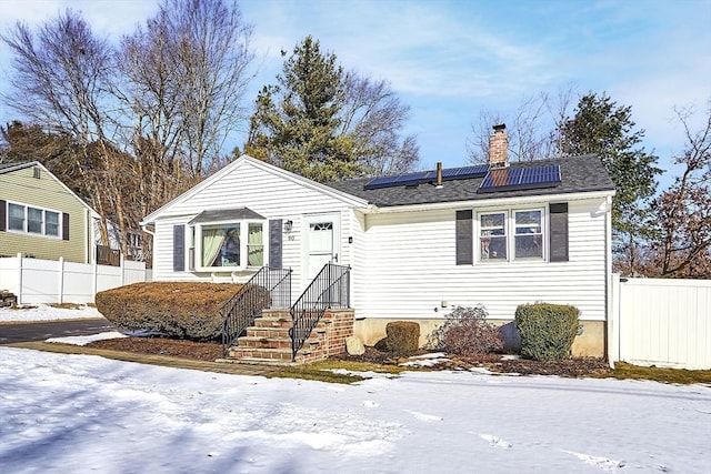 view of front of house featuring solar panels