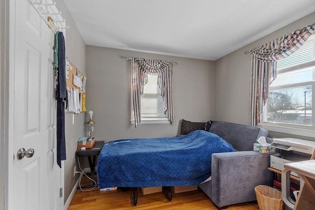 bedroom with light hardwood / wood-style floors