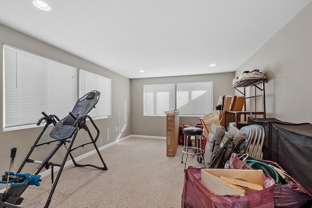 workout area featuring light colored carpet