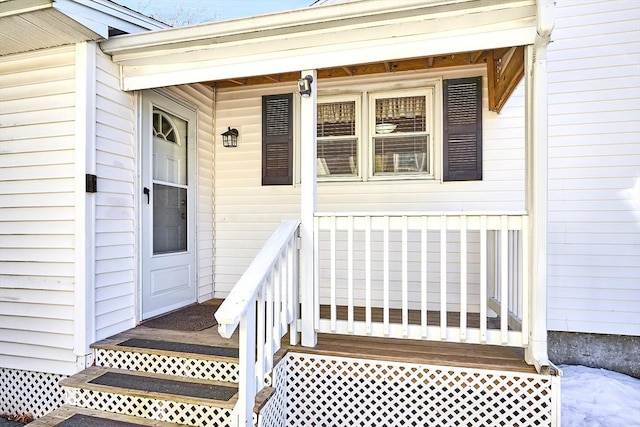 doorway to property featuring a porch