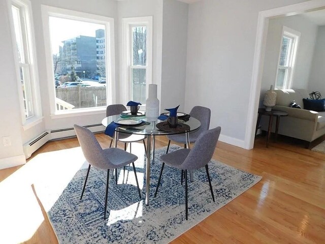 15 Phillips St, Weymouth, MA 02188 - dining room with plenty of natural light, baseboards, and wood finished floors