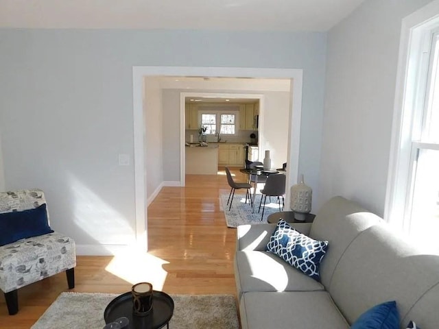 15 Phillips St, Weymouth, MA 02188 - living room with light wood-style floors and baseboards