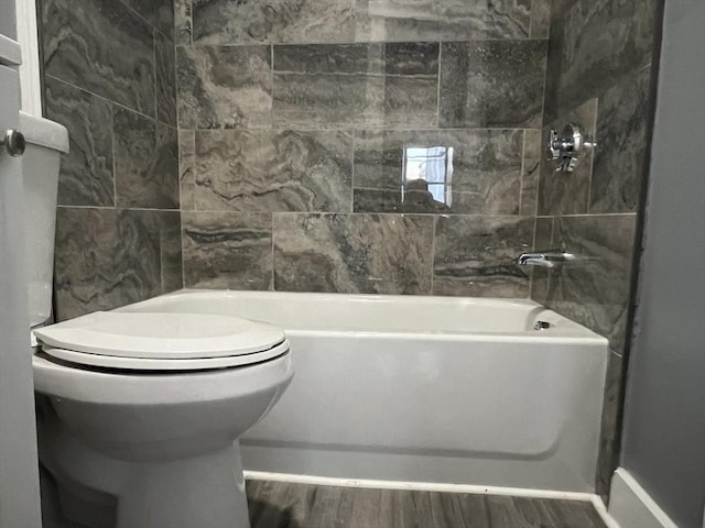 bathroom featuring toilet and wood finished floors