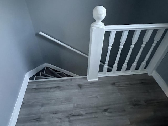 stairway with wood finished floors