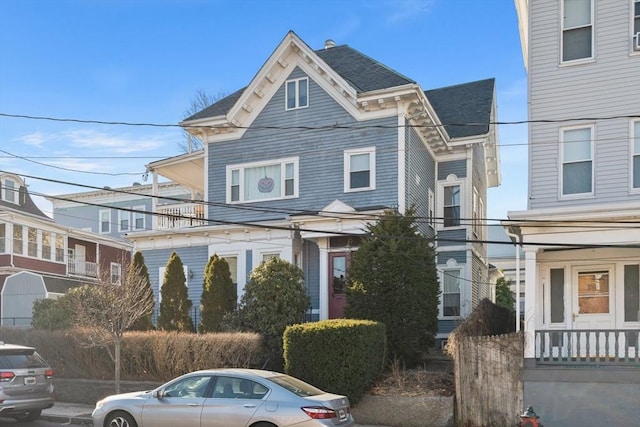 view of front of home featuring roof with shingles