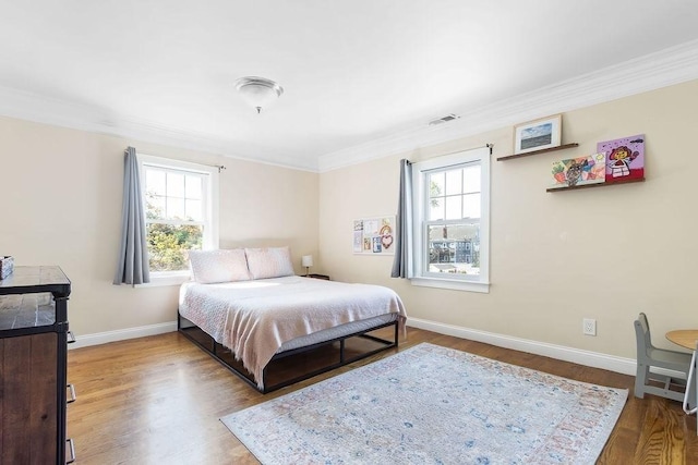 32 Jewett St, Boston, MA 02131 - bedroom featuring ornamental molding, wood finished floors, and baseboards