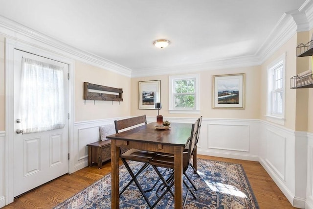 32 Jewett St, Boston, MA 02131 - dining space with light wood-type flooring, ornamental molding, wainscoting, and a decorative wall