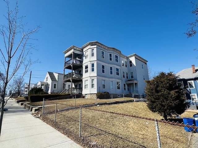 view of property exterior with fence