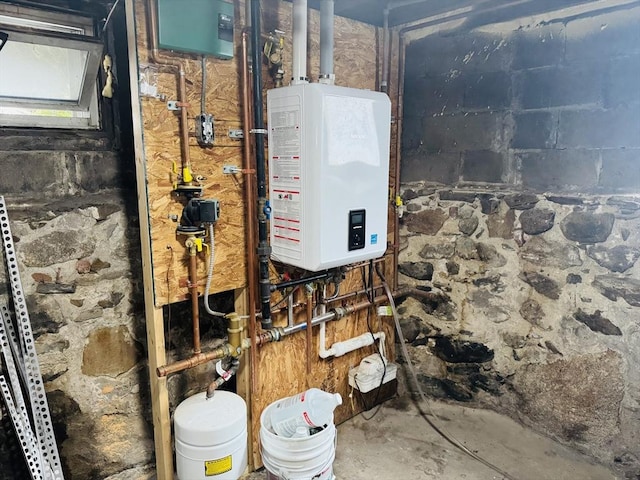 utility room featuring tankless water heater